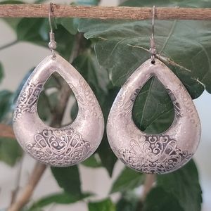 Metal teardrop earrings.